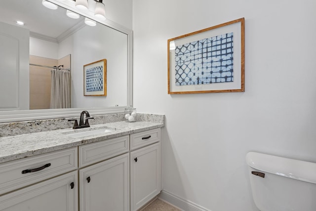 bathroom with walk in shower, vanity, toilet, and crown molding