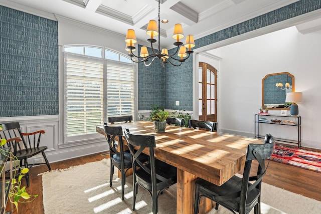 dining space featuring plenty of natural light, dark hardwood / wood-style flooring, and a notable chandelier