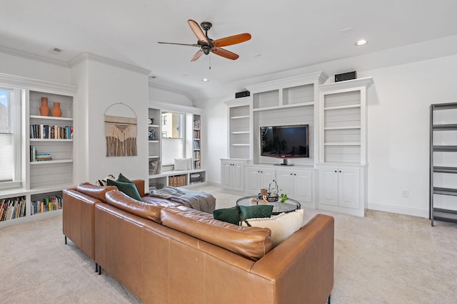 carpeted living room with ceiling fan, ornamental molding, and vaulted ceiling