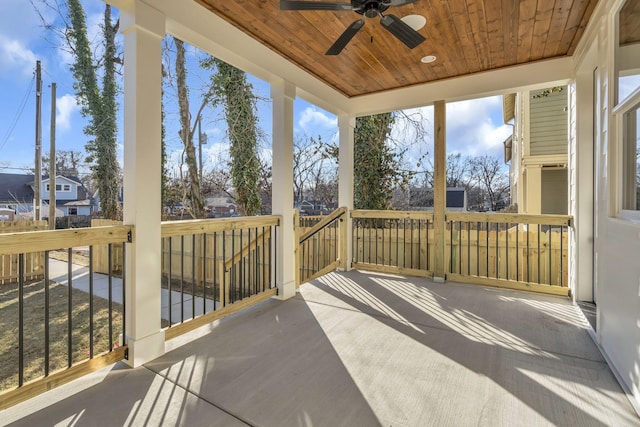 exterior space with ceiling fan