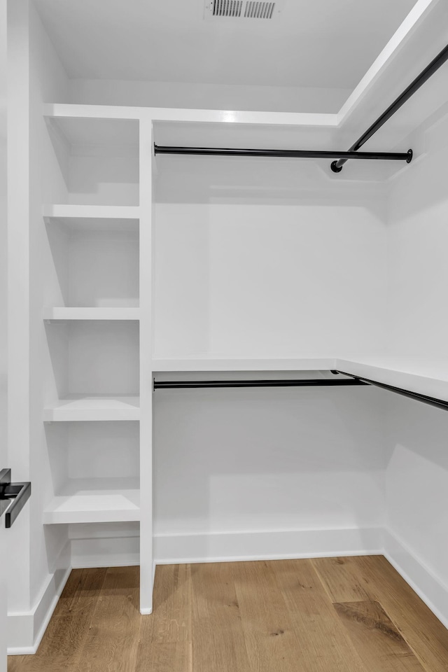 walk in closet featuring hardwood / wood-style floors