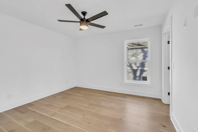 unfurnished room with ceiling fan and light wood-type flooring