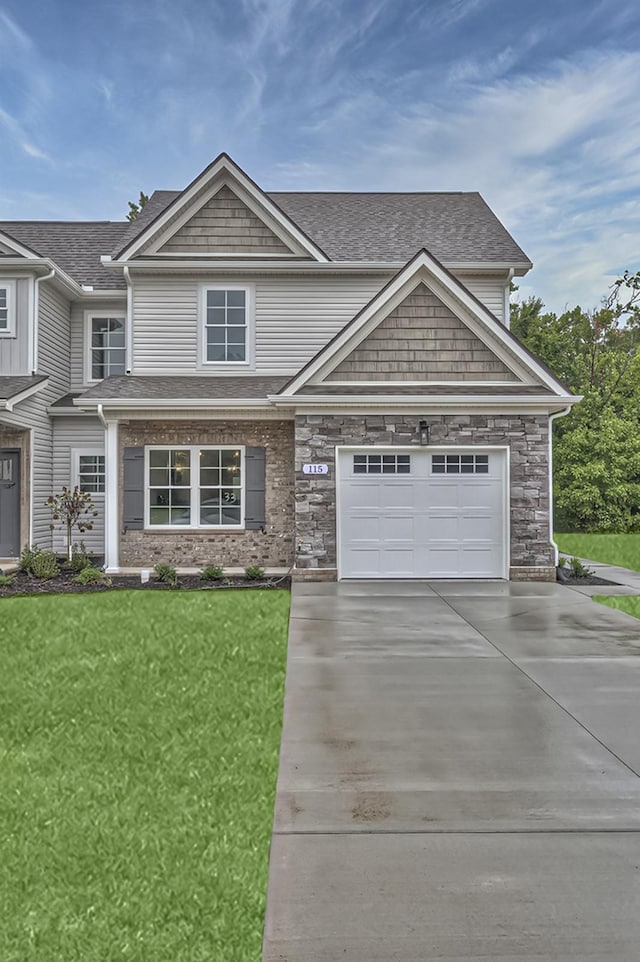 craftsman inspired home with a front lawn