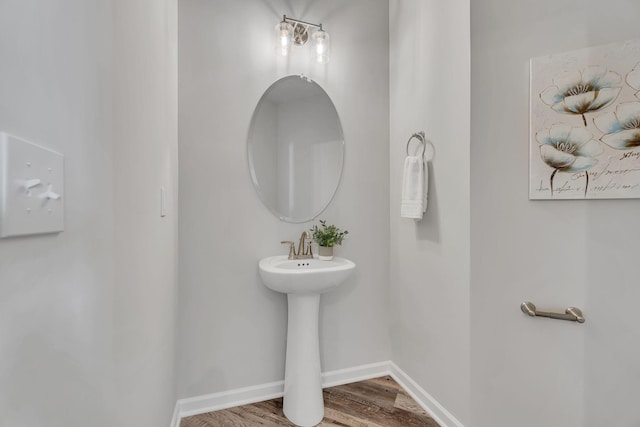 bathroom with hardwood / wood-style flooring