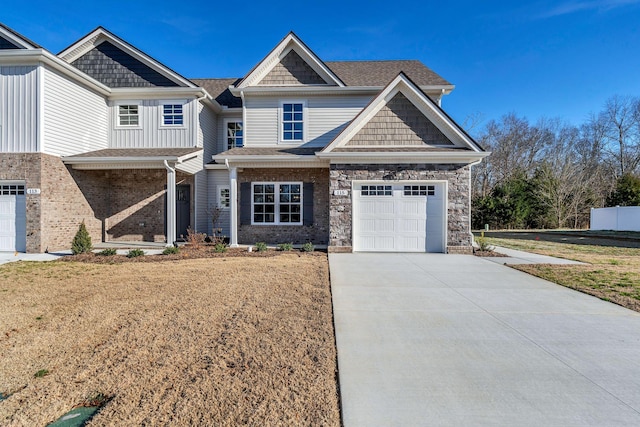 craftsman house featuring a front yard and a garage