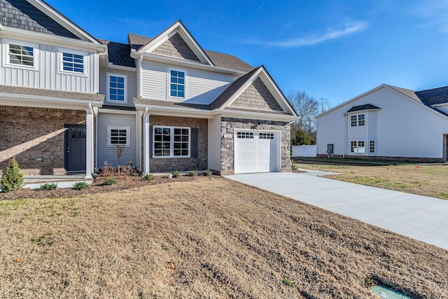 craftsman house with a garage and a front lawn