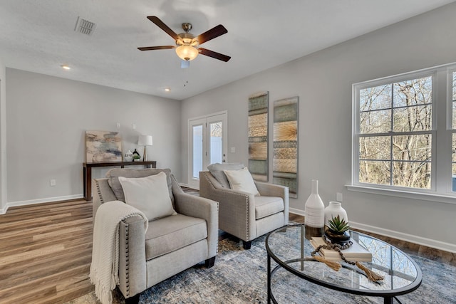 interior space featuring hardwood / wood-style flooring, plenty of natural light, french doors, and ceiling fan