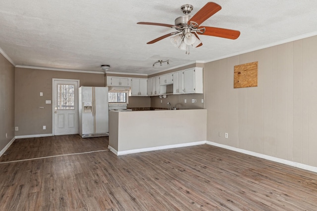 kitchen featuring dark hardwood / wood-style floors, white cabinetry, white fridge with ice dispenser, crown molding, and a textured ceiling