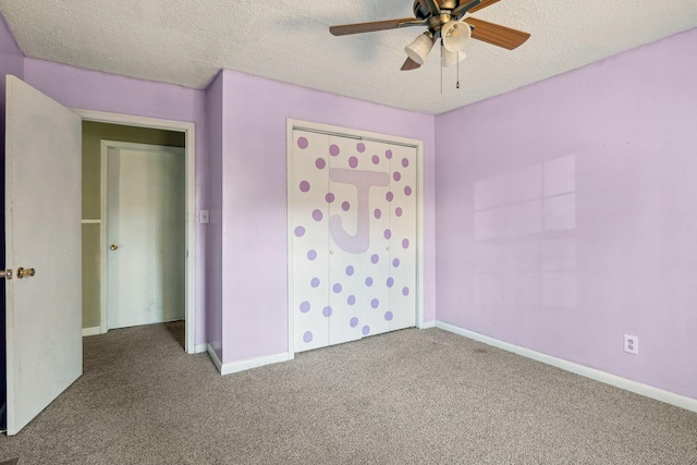 unfurnished bedroom with a closet, a textured ceiling, and carpet