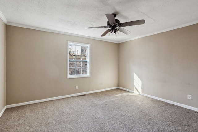 unfurnished room with ceiling fan, ornamental molding, a textured ceiling, and carpet