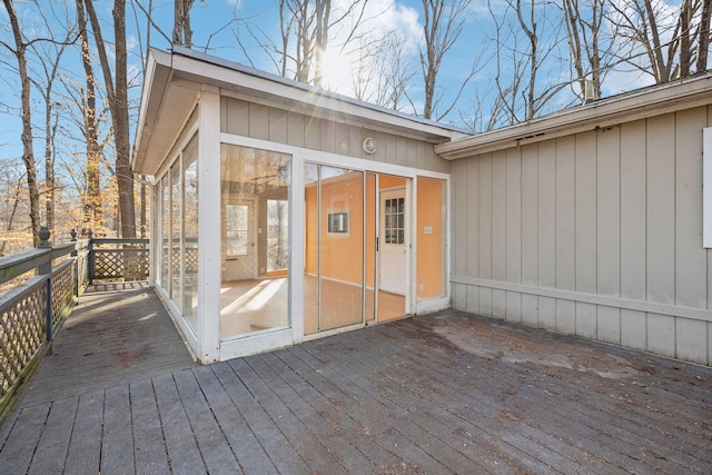 wooden terrace featuring a sunroom