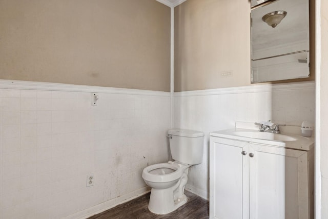 bathroom with vanity, wood-type flooring, and toilet