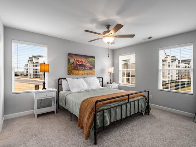 carpeted bedroom featuring ceiling fan