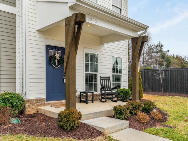 view of exterior entry featuring a porch