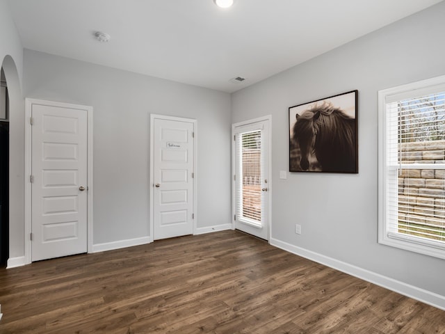 unfurnished room featuring dark hardwood / wood-style floors