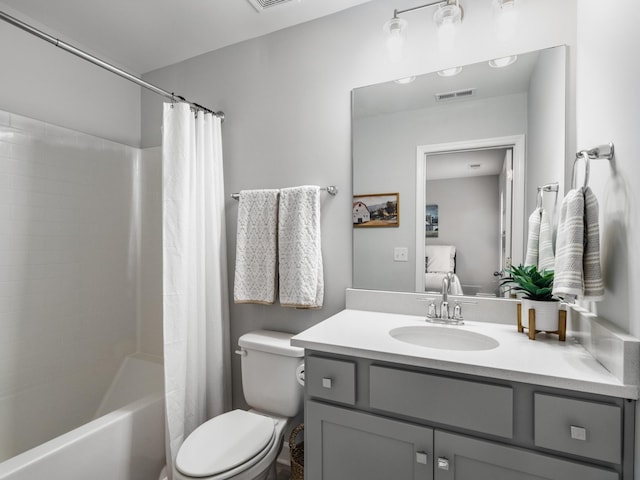 full bathroom featuring vanity, shower / bath combination with curtain, and toilet