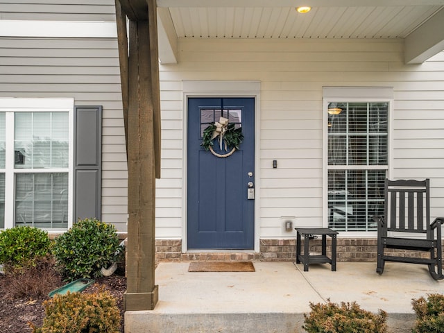 doorway to property with a porch