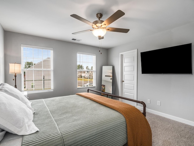 bedroom with ceiling fan and carpet flooring