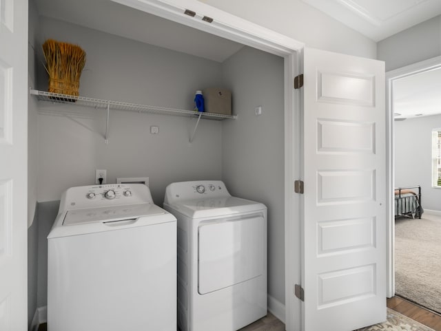 laundry room with carpet floors and independent washer and dryer