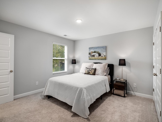 bedroom with light carpet