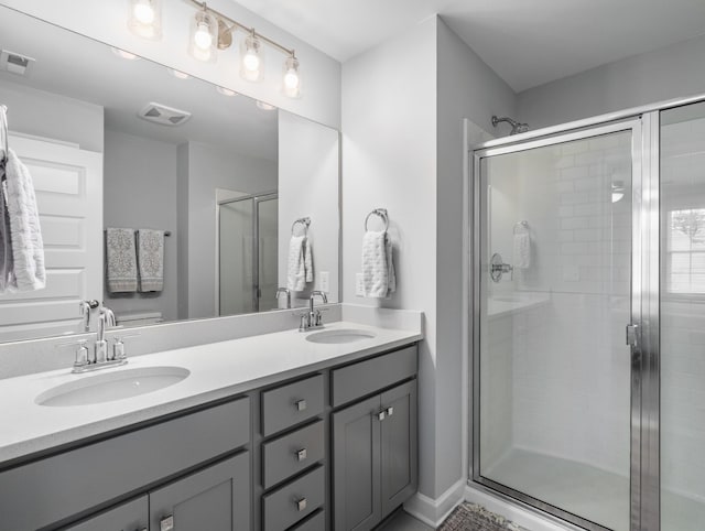 bathroom with vanity and an enclosed shower