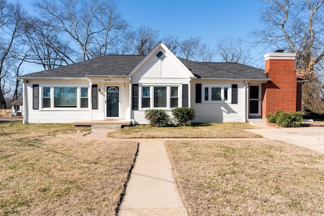 ranch-style home with a front yard