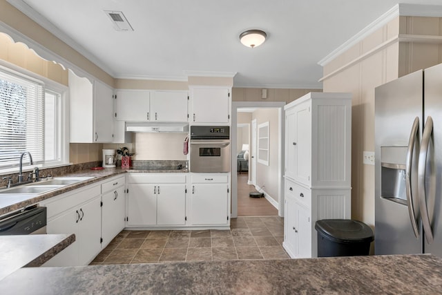 kitchen with sink, crown molding, stainless steel appliances, and white cabinets