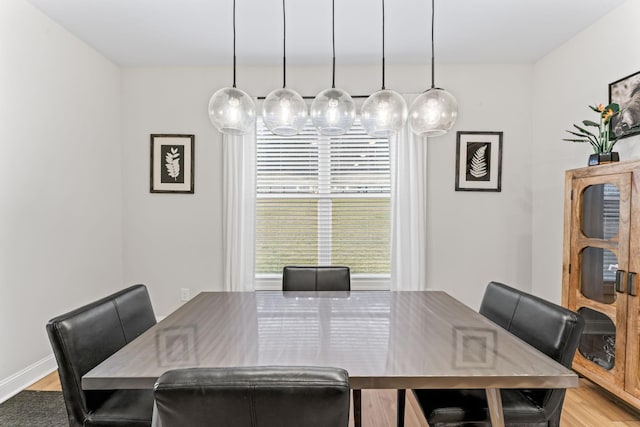 dining area featuring light wood-type flooring