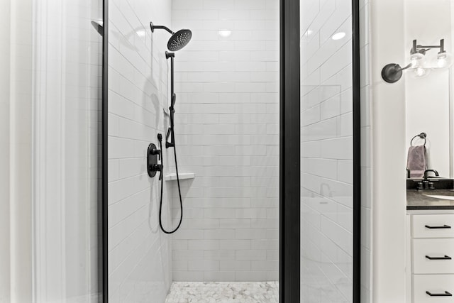 bathroom featuring an enclosed shower and vanity