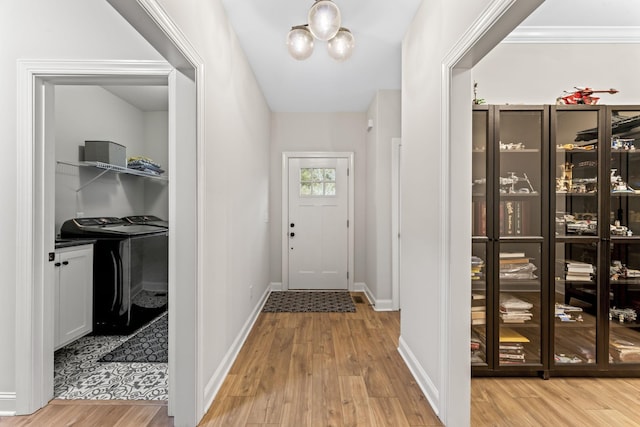 entryway featuring washer and clothes dryer and light wood-type flooring