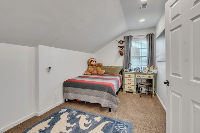 bedroom with lofted ceiling and carpet floors