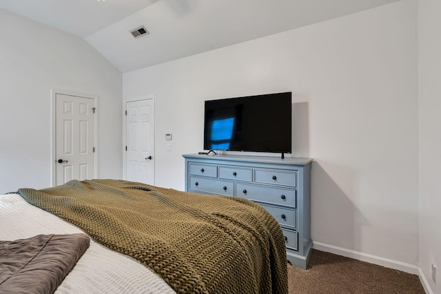 carpeted bedroom with lofted ceiling