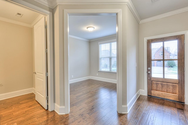 foyer entrance featuring hardwood / wood-style flooring and crown molding