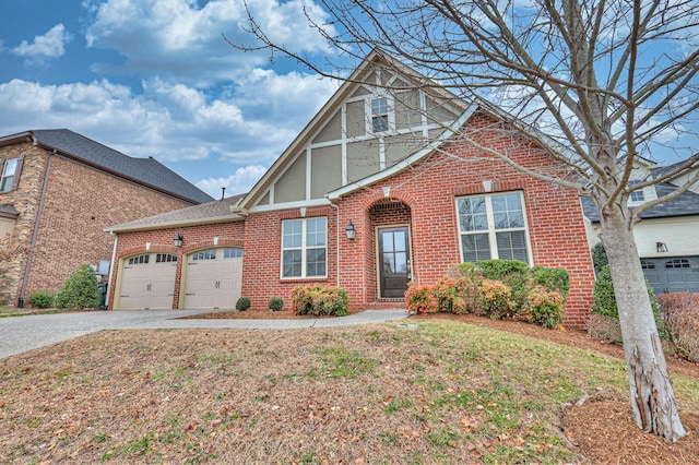 view of front facade with a garage and a front yard