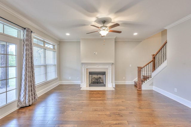 unfurnished living room with crown molding, ceiling fan, and hardwood / wood-style floors