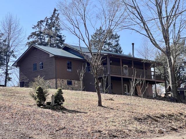 rear view of property with a deck