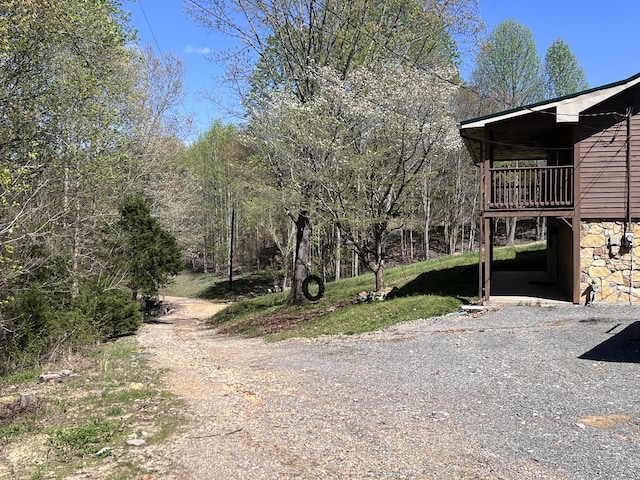 view of street with gravel driveway