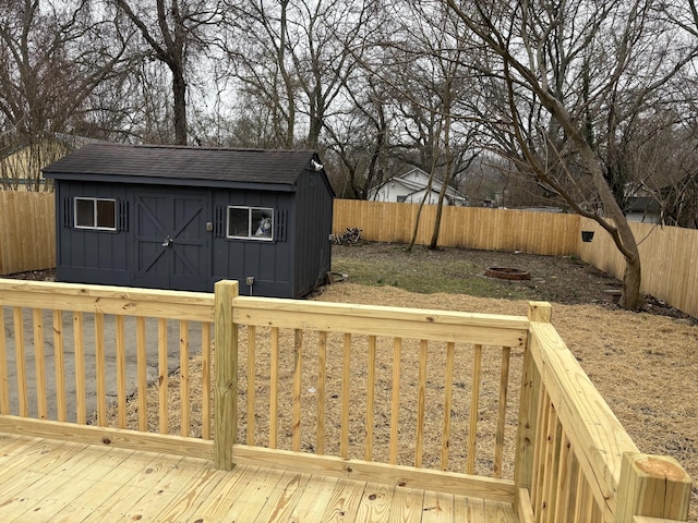 wooden terrace featuring a shed