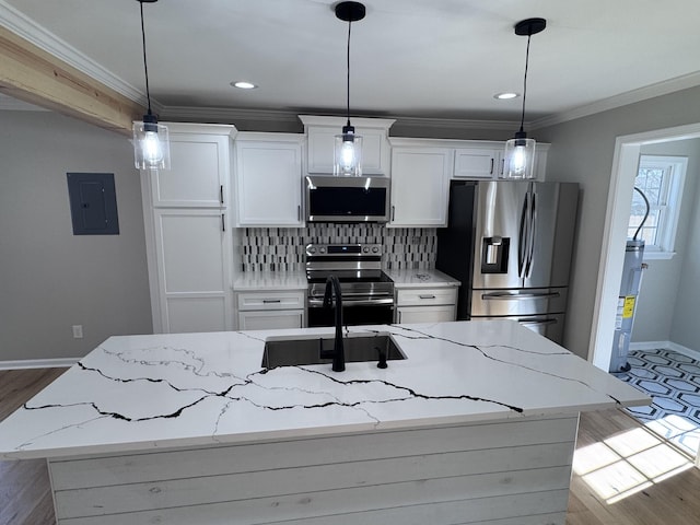 kitchen featuring light stone counters, white cabinetry, and stainless steel appliances