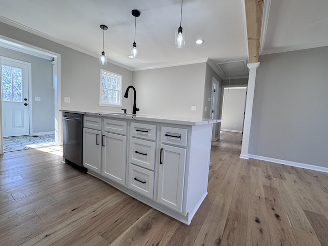 kitchen featuring crown molding, light hardwood / wood-style flooring, dishwasher, white cabinetry, and hanging light fixtures