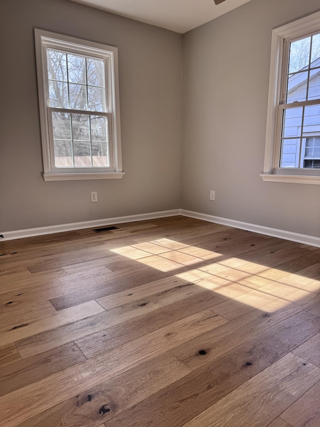 unfurnished room with light hardwood / wood-style flooring