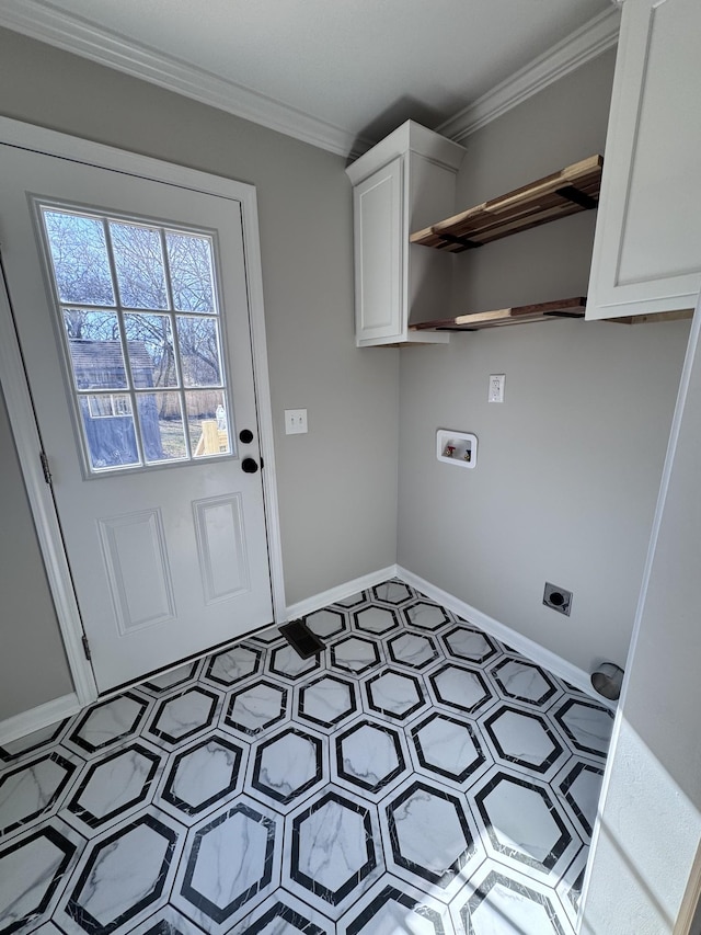 washroom featuring cabinets, washer hookup, ornamental molding, and hookup for an electric dryer