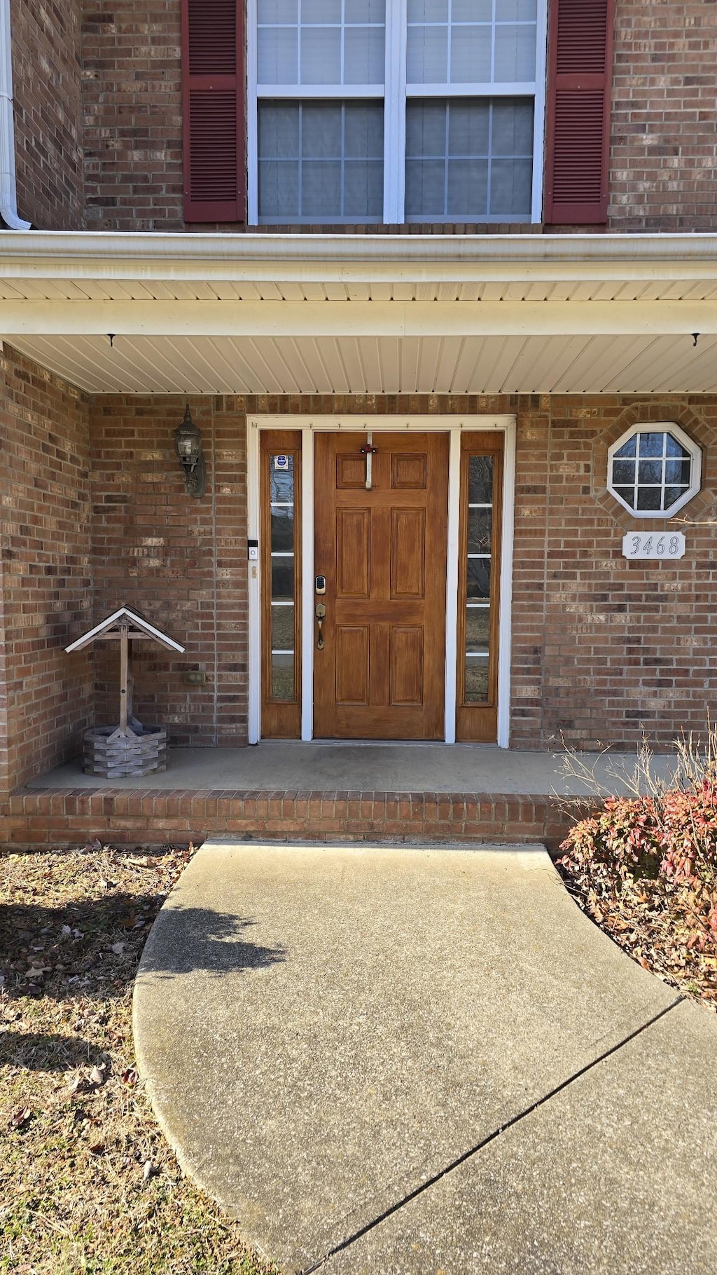 view of exterior entry featuring covered porch