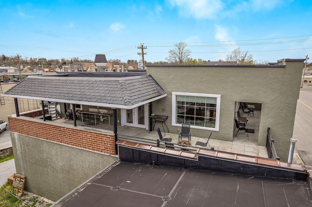 rear view of house with a patio