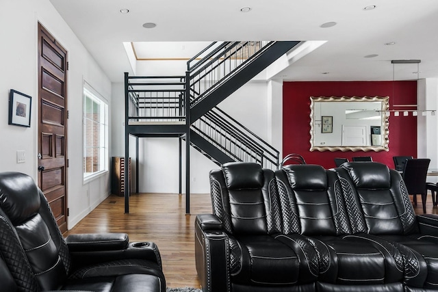 home theater room featuring hardwood / wood-style floors