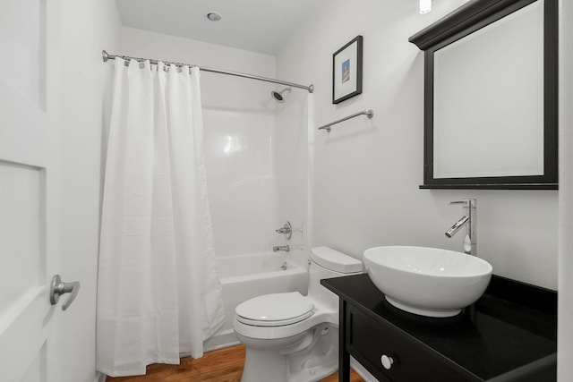 full bathroom with shower / bath combination with curtain, wood-type flooring, toilet, and vanity