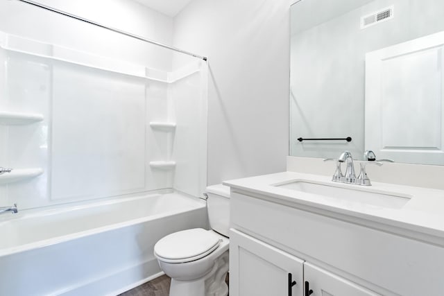 full bathroom with hardwood / wood-style flooring, bathing tub / shower combination, vanity, and toilet