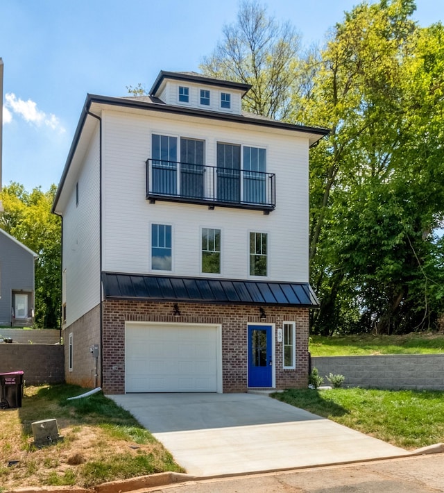 view of front of home featuring a balcony and a garage