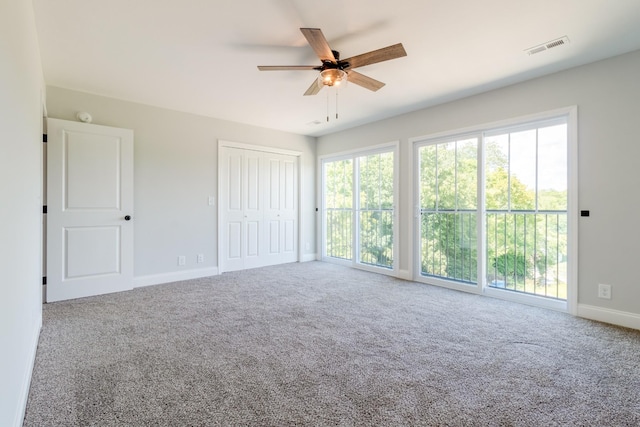 interior space featuring carpet floors, a closet, and ceiling fan