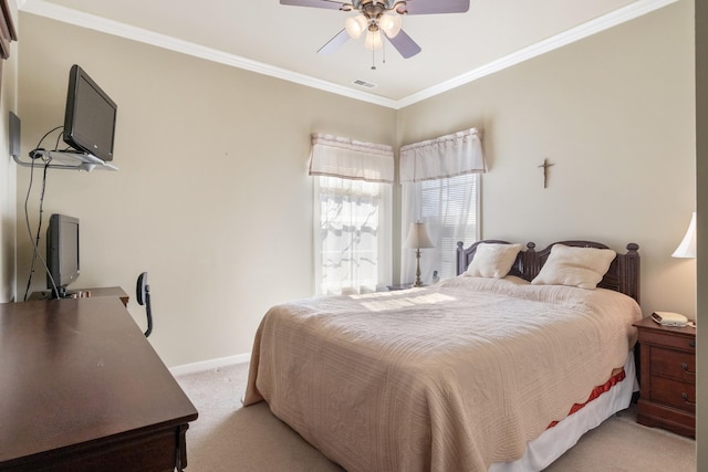 carpeted bedroom featuring ornamental molding and ceiling fan